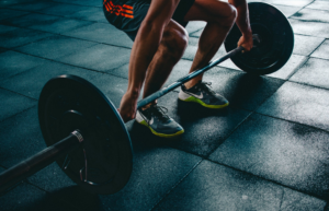 man lifting weights